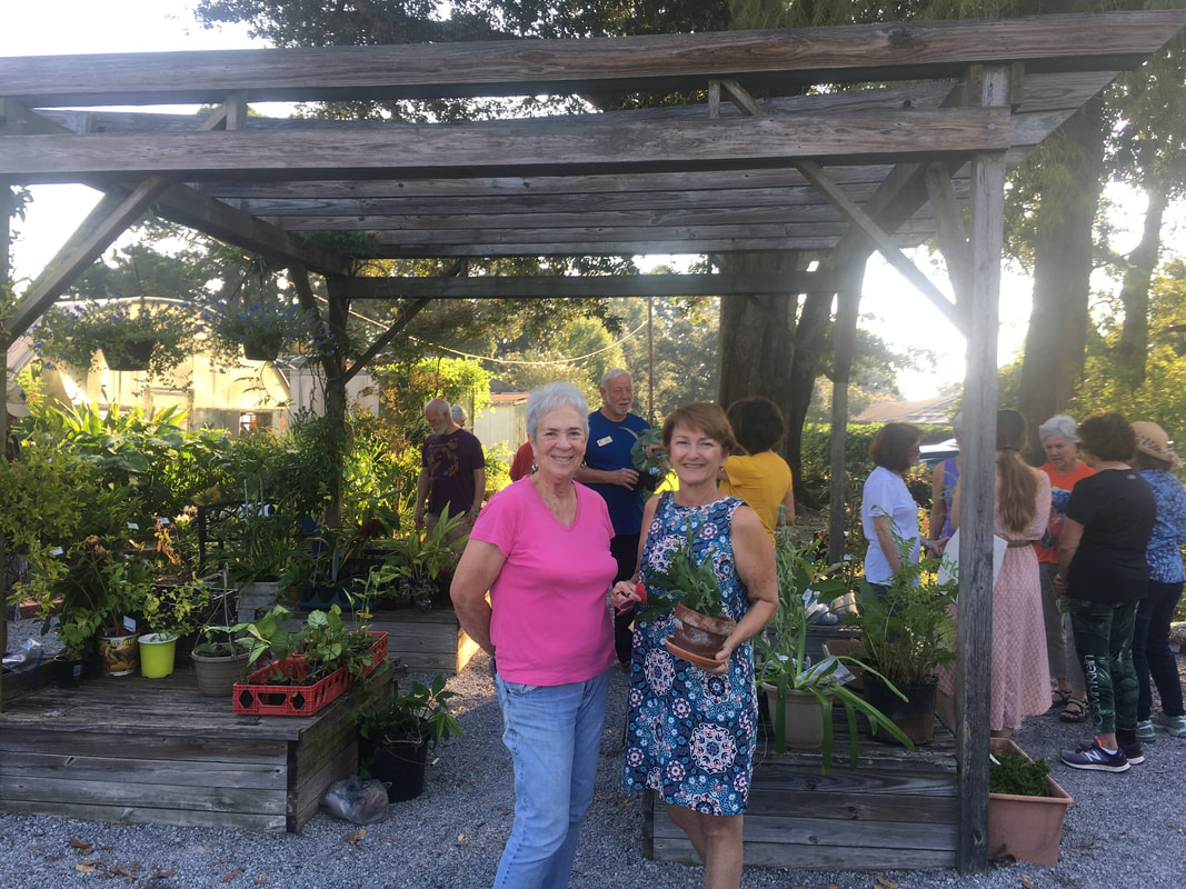 Two happy attendees at the Lafayette Master Gardener Plant Swap